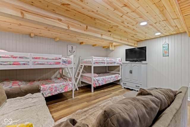 bedroom with wooden ceiling and wood finished floors