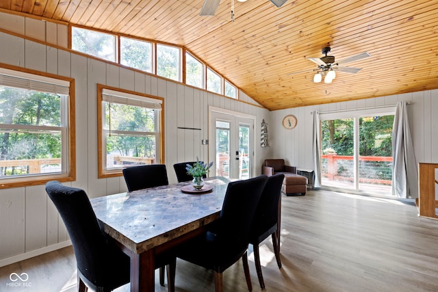 dining area featuring french doors, light wood finished floors, ceiling fan, high vaulted ceiling, and wooden ceiling