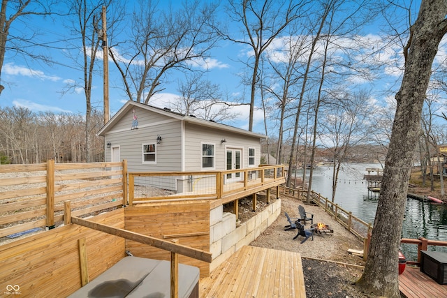 exterior space with french doors and a deck with water view