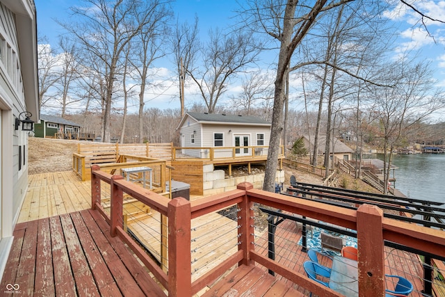 deck featuring a boat dock and a water view