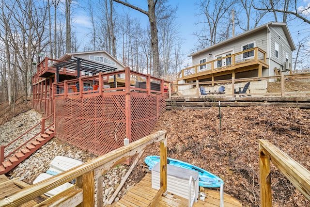 view of yard featuring fence, a deck, and stairs