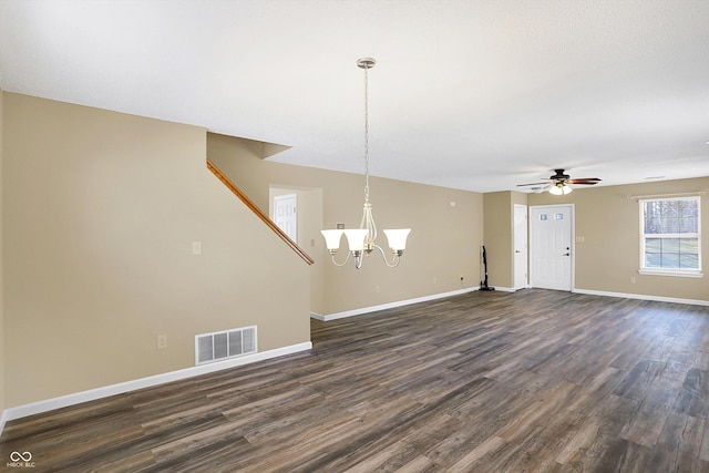 interior space with visible vents, baseboards, dark wood-style flooring, and ceiling fan with notable chandelier