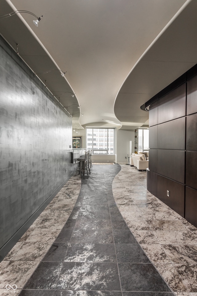 hall featuring tile patterned flooring