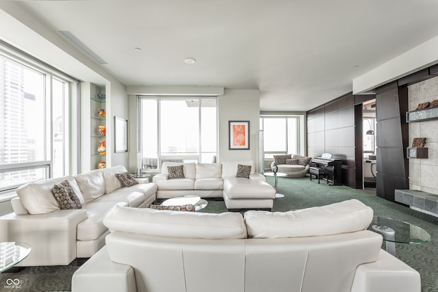 carpeted living room with a healthy amount of sunlight