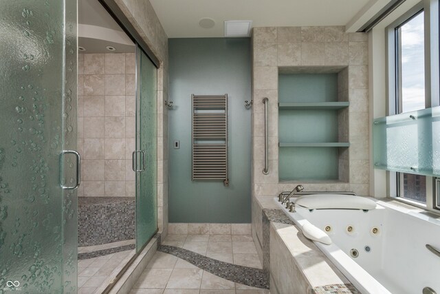 bathroom with radiator, separate shower and tub, and tile patterned floors