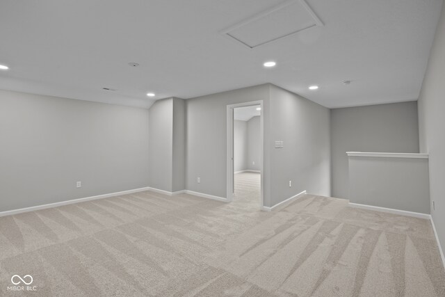 basement featuring light colored carpet