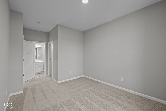 spare room with light colored carpet