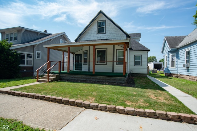 view of front of home with covered porch and a front yard