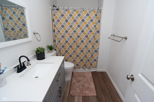 bathroom with vanity, wood-type flooring, toilet, and a shower with shower curtain