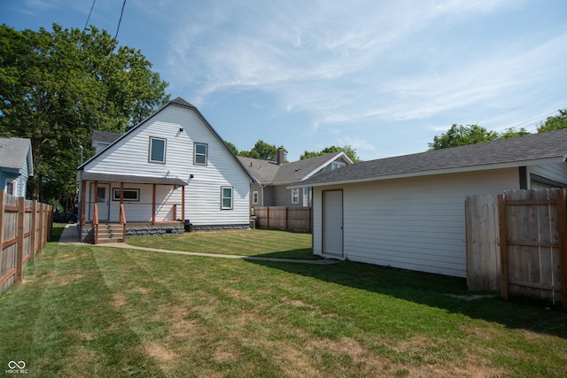 back of property with a porch and a lawn