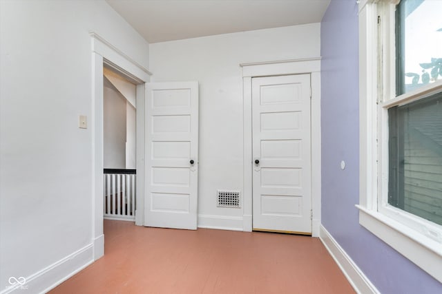 unfurnished bedroom with a closet and hardwood / wood-style flooring