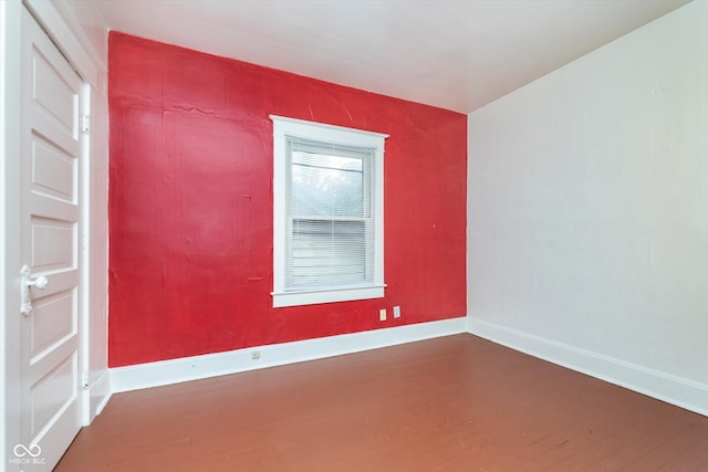 unfurnished room featuring hardwood / wood-style flooring