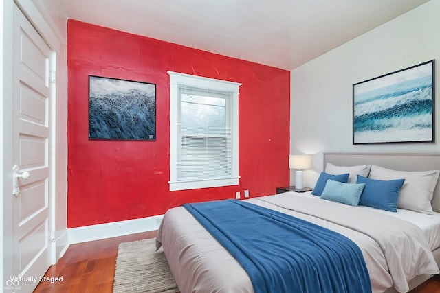 bedroom featuring dark hardwood / wood-style flooring