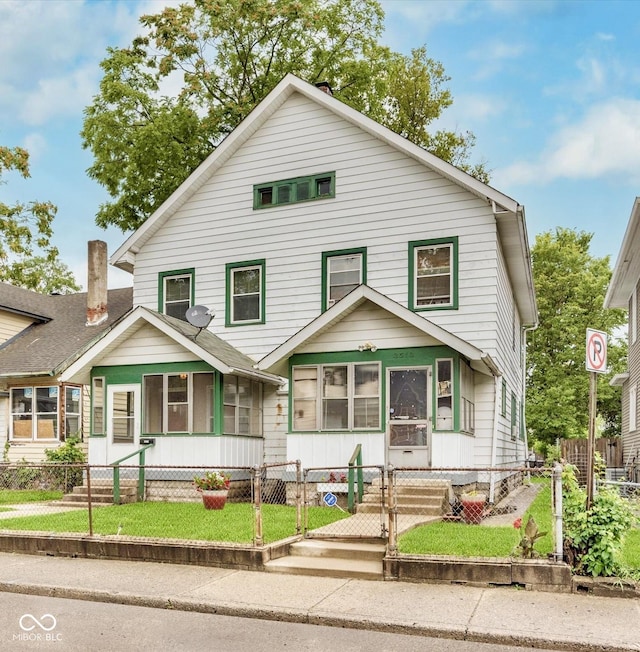 view of front facade with a fenced front yard