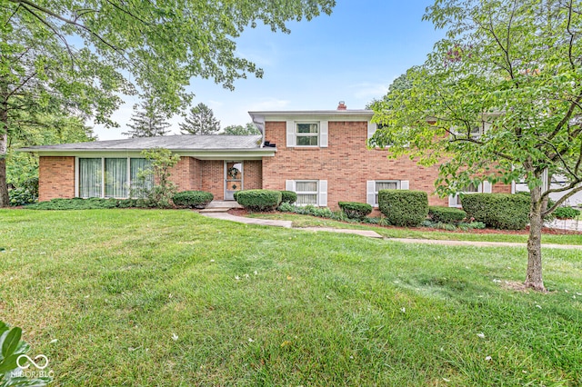 split level home with a front lawn