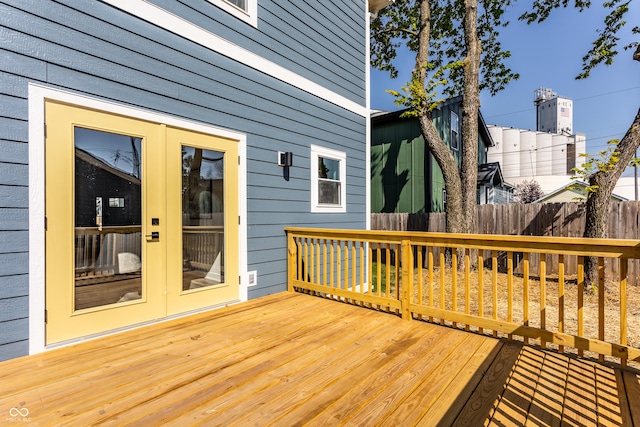 deck with french doors and fence