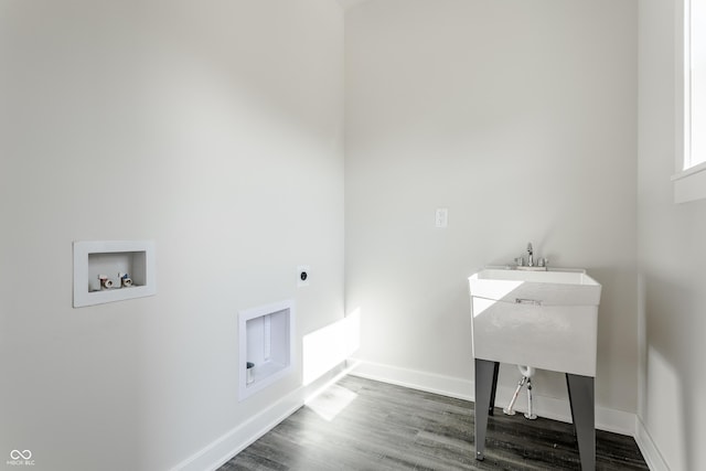 laundry area featuring laundry area, baseboards, dark wood-style floors, hookup for a washing machine, and electric dryer hookup