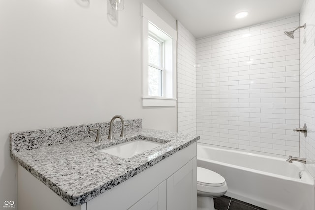 full bath with tile patterned floors, vanity, toilet, and shower / bathtub combination