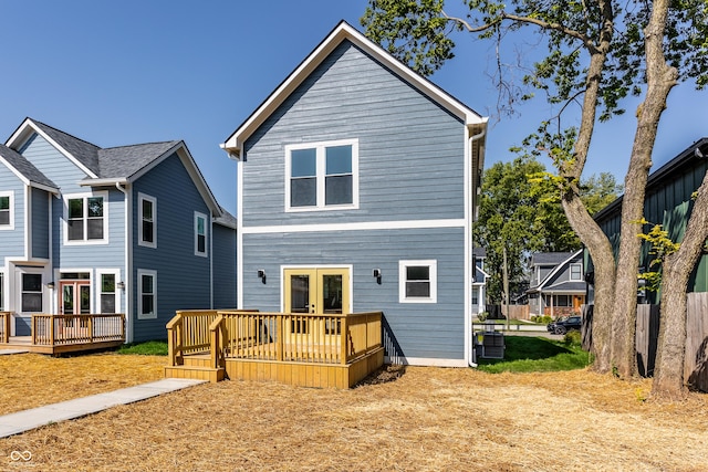 back of house featuring cooling unit and a wooden deck