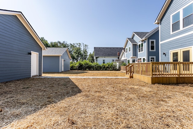 view of yard with a wooden deck