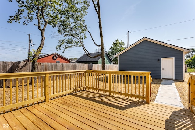 wooden deck with a fenced backyard