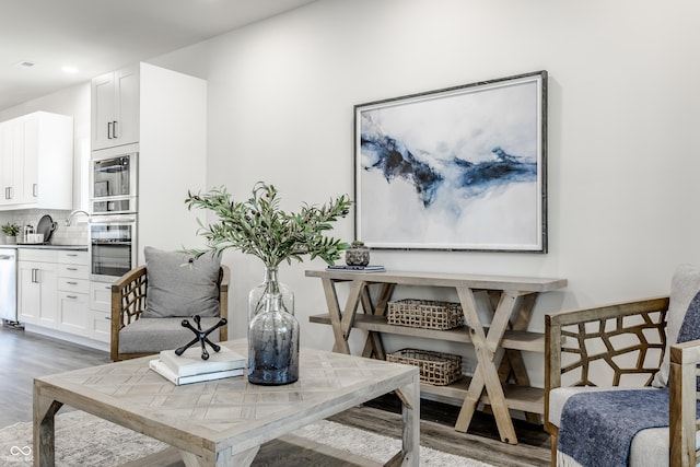 dining space featuring wood finished floors and recessed lighting