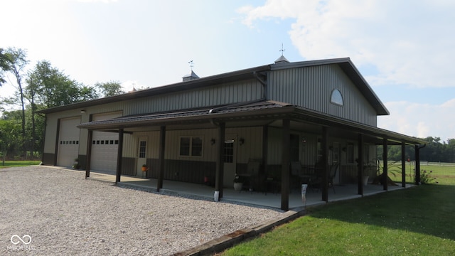 exterior space with a garage and a yard