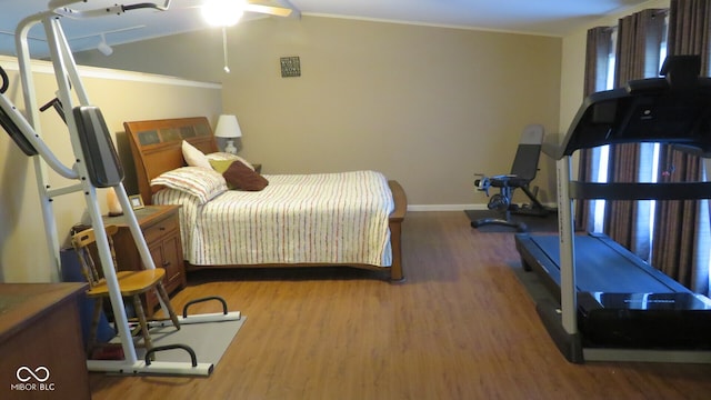 bedroom featuring wood-type flooring, crown molding, and ceiling fan