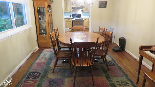 dining area featuring dark hardwood / wood-style floors