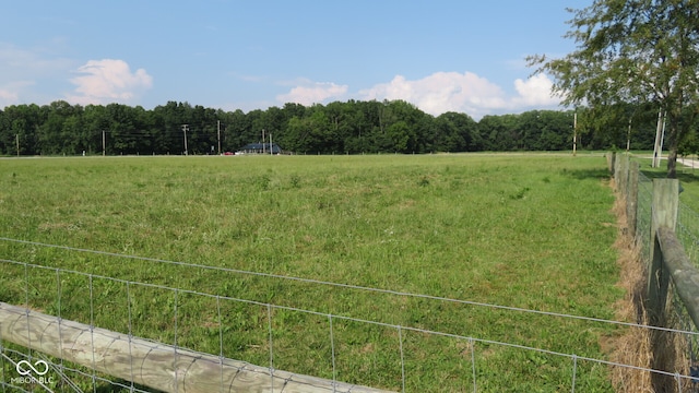 view of yard with a rural view