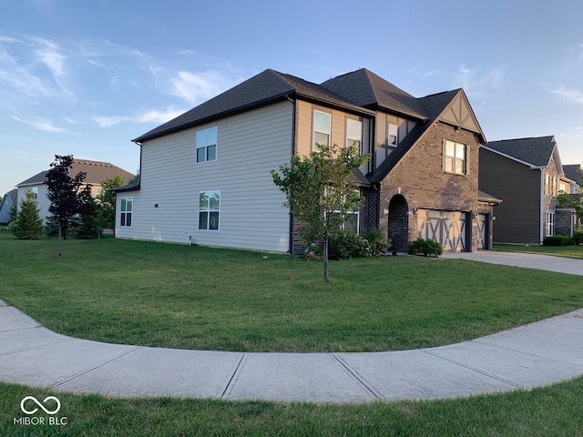 view of front of property with a garage and a front yard