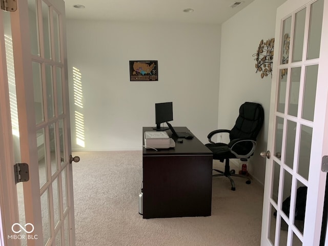 carpeted office space featuring french doors