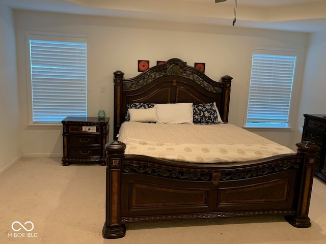 bedroom featuring light colored carpet