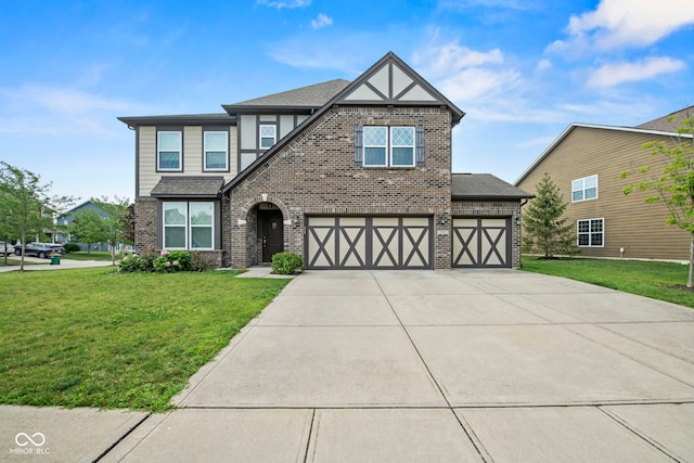 tudor-style house with a garage and a front lawn