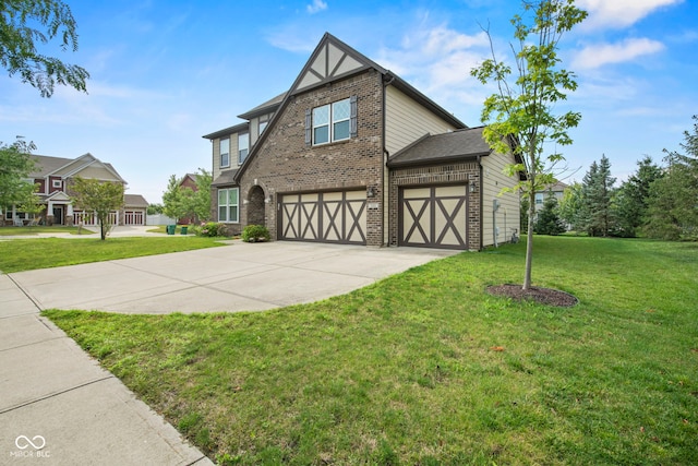 tudor house with a garage and a front yard