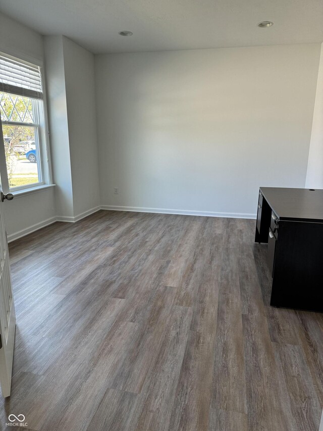 spare room featuring dark hardwood / wood-style flooring