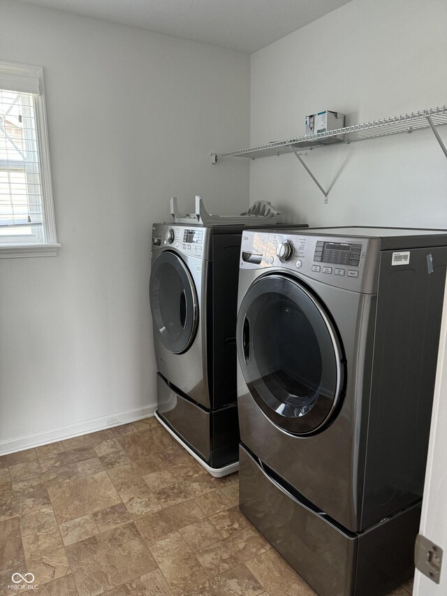 laundry area with washing machine and dryer