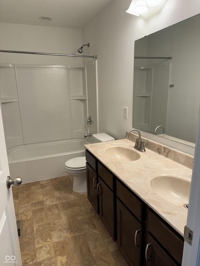 full bathroom with vanity, bathing tub / shower combination, and toilet