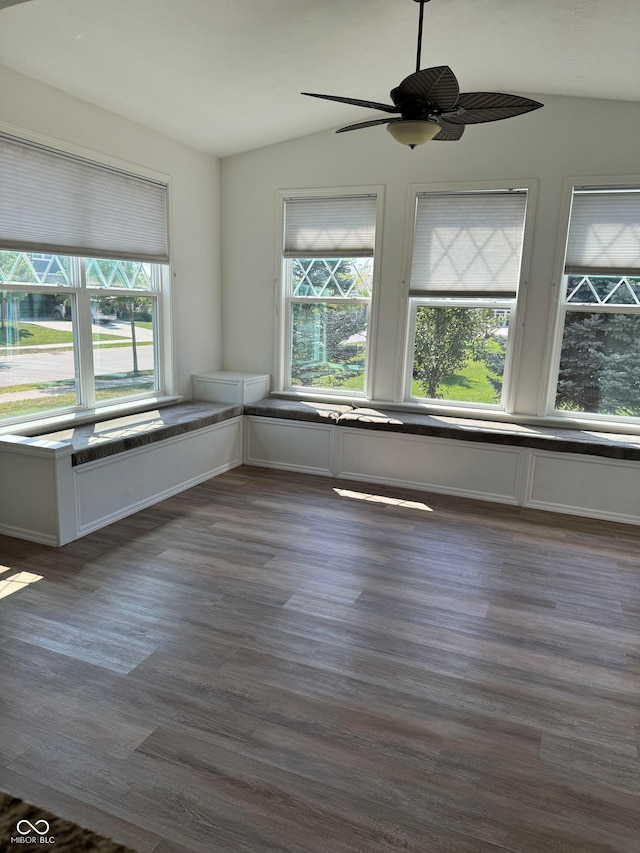 spare room with dark wood-type flooring, ceiling fan, and lofted ceiling