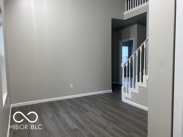 spare room featuring dark hardwood / wood-style floors