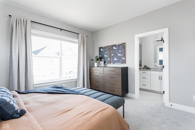 carpeted bedroom with ensuite bathroom