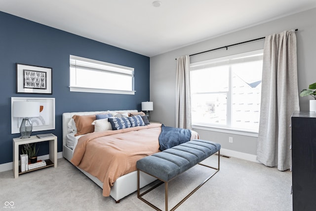 bedroom featuring light colored carpet