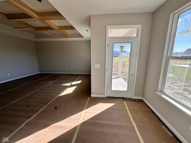 doorway to outside with beamed ceiling and coffered ceiling