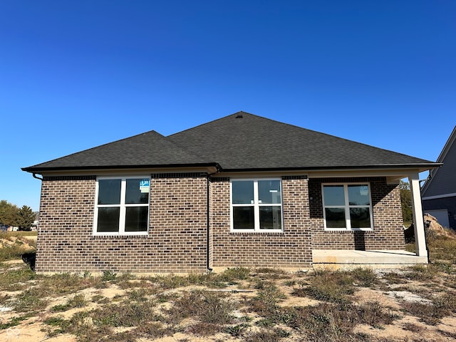 view of side of property with a patio