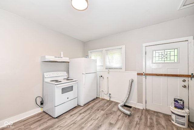 kitchen with light hardwood / wood-style floors and white appliances