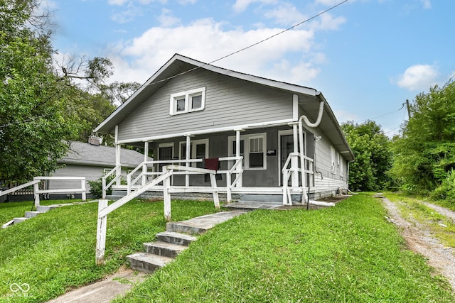 exterior space featuring a yard and covered porch