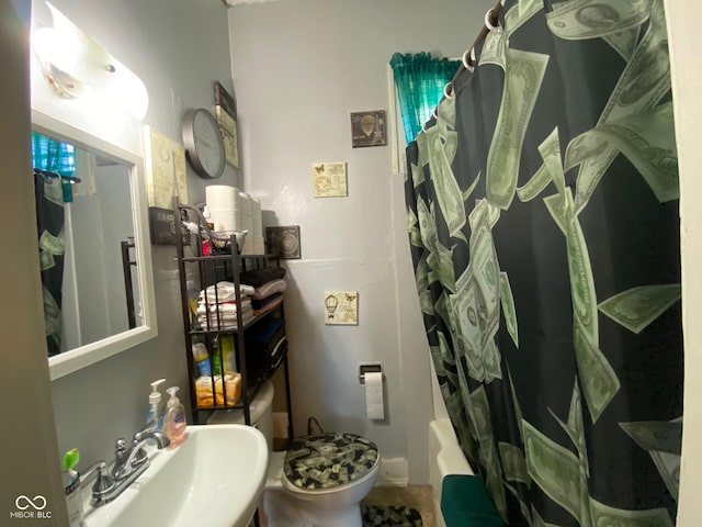 full bathroom with sink, toilet, and shower / tub combo