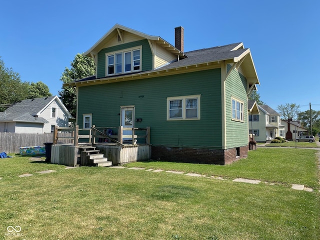 rear view of house with a lawn