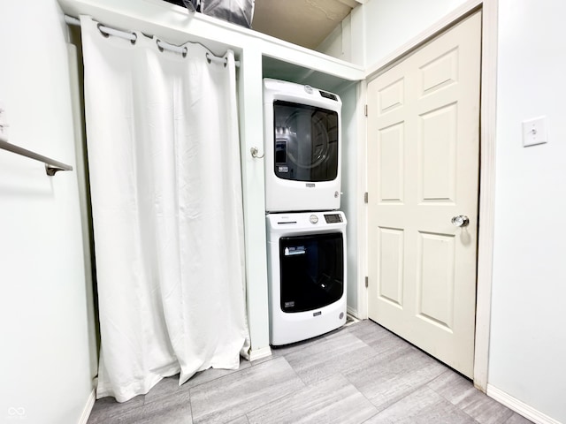 laundry room featuring stacked washing maching and dryer