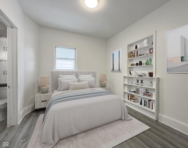 bedroom featuring hardwood / wood-style flooring